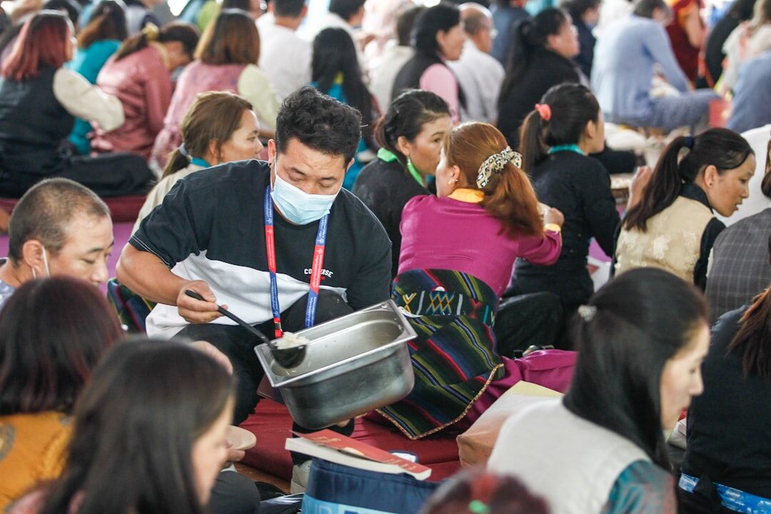 Diverse group of professionals discussing around a table during a knowledge sharing session